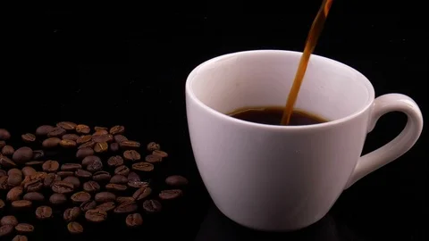 Coffee cup and coffee beans. A white cup of evaporating coffee on the table Stock Footage 124749078