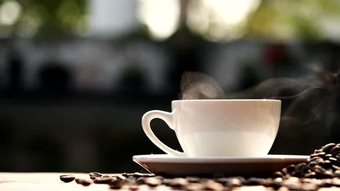 Coffee cup and coffee beans with natural steam smoke of coffee Stock Footage 148026457