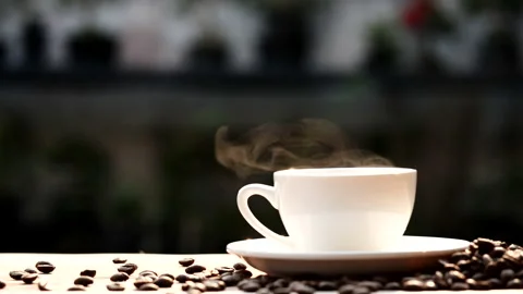 Coffee cup and coffee beans with natural steam smoke of coffee Stock Footage 148026517