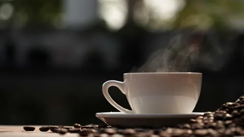 Coffee cup and coffee beans with natural steam smoke of coffee Stock Footage 148026586