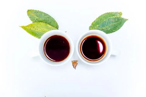 Coffee cup and coffee beans on white background Stock Photos