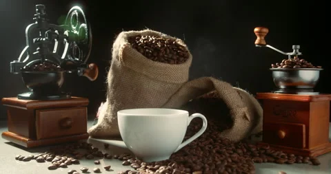 Coffee cup and coffee beans.Hot coffeecup and handful of coffee beans. Close-up Stock Footage 220794850