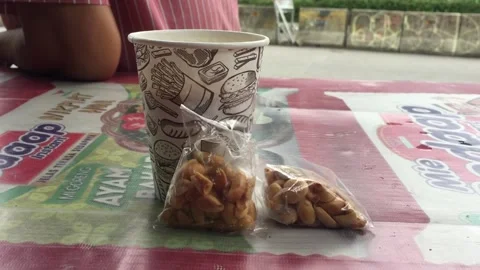 Coffee Cup and Fried Nuts Stock Footage 245355386