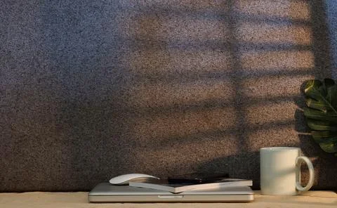 Coffee cup and laptop computer on white table. Stock Photos