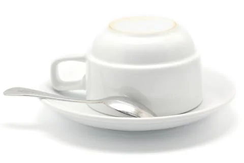 Coffee cup and spoon Stock Photos
