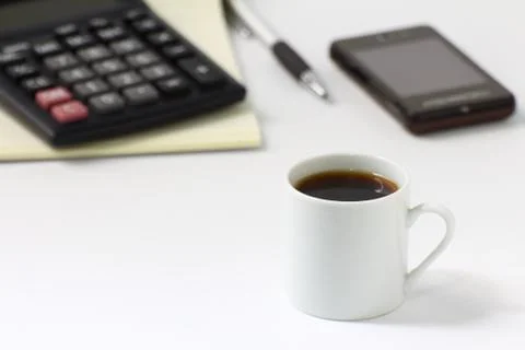 Coffee cup and workspace Stock Photos