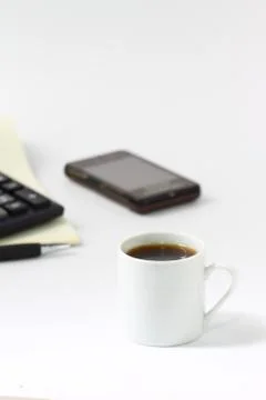 Coffee cup and workspace Stock Photos