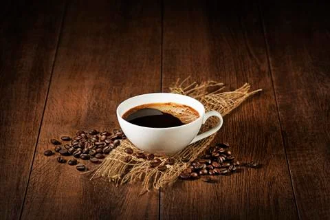 Coffee cup with beans background Stock Photos