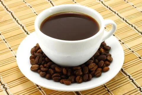 Coffee cup with beans Stock Photos