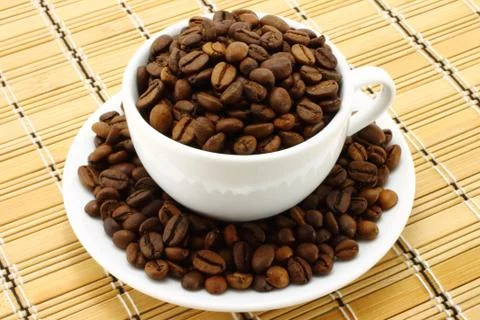 Coffee cup with beans Stock Photos