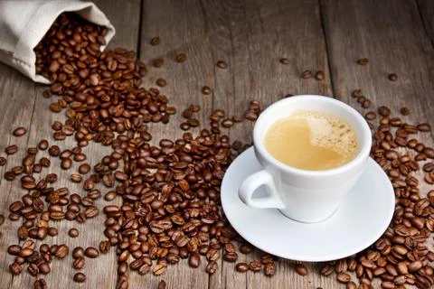 Coffee cup with beans Stock Photos