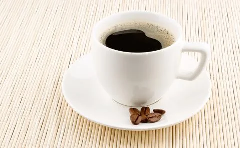 Coffee cup with beans Stock Photos