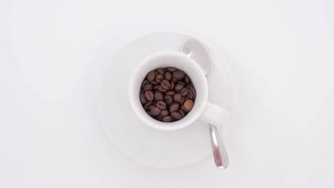 Coffee cup being filled with beans Stock Footage 184469227
