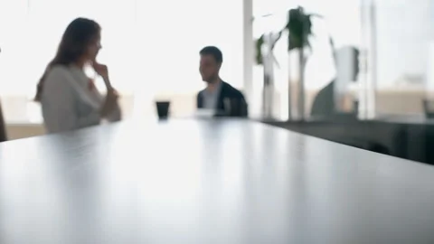 Coffee cup is being put to the counter with chatting colleagues on the Video stock 91557378