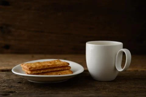Coffee cup with biscuit Stock Photos