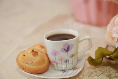 Coffee cup black drink invigorating and food snack sweet cake, confectionery Stock Photos