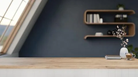 Coffee cup with book and vase on wooden table across float bookshelf and sl.. Ilustración de archivo