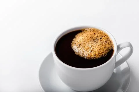 Coffee cup with bubbles isolated on white background. Stock Photos