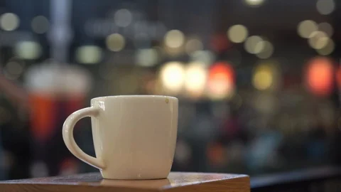 Coffee cup with cafe background Stock Footage 100529973