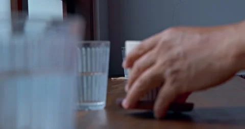 Coffee cup, ceramic mug, hand, cafe, wooden table Stock Footage 345834066