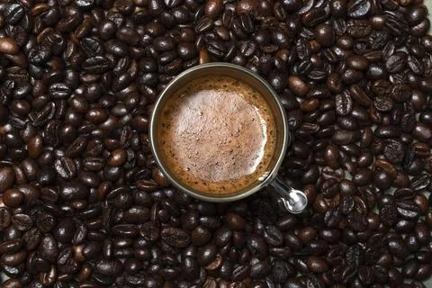 Coffee in cup close up bean texture background. Stock Photos