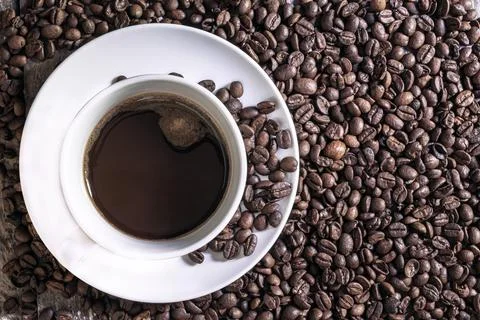 Coffee in cup close up bean texture background. Stock Photos