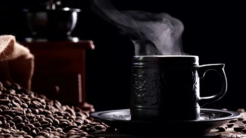 Coffee Cup. Close-up natural steaming smoke from ceramic black coffee mug, 4K Video stock 223382405
