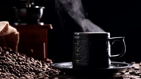 Coffee Cup. Close-up natural steaming smoke from ceramic black coffee mug, 4K Stock Footage 223383356