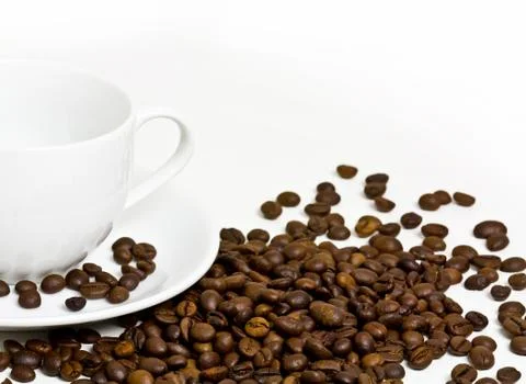 Coffee cup with coffee bean on table Stock Photos