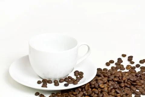 Coffee cup with coffee bean on table Stock Photos