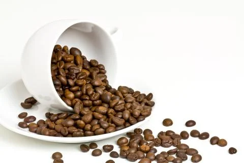 Coffee cup with coffee bean on table Stock Photos