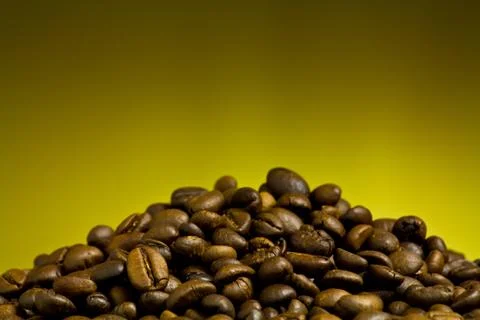 Coffee cup with coffee bean on table Stock Photos