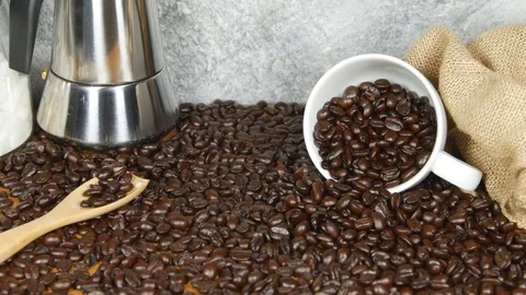 Coffee cup on coffee beans background Video stock 73181208
