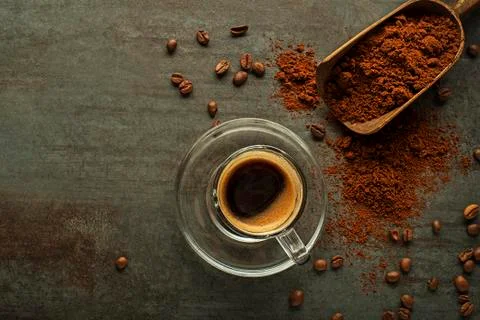 Coffee cup with coffee beans background Stock Photos