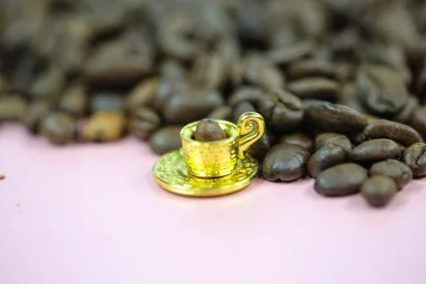 Coffee cup with coffee beans, mini cup, miniature cup Stock Photos