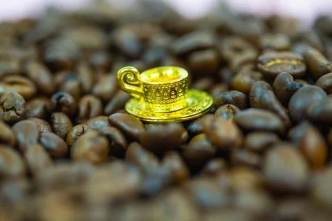 Coffee cup with coffee beans, mini cup, miniature cup Stock Photos