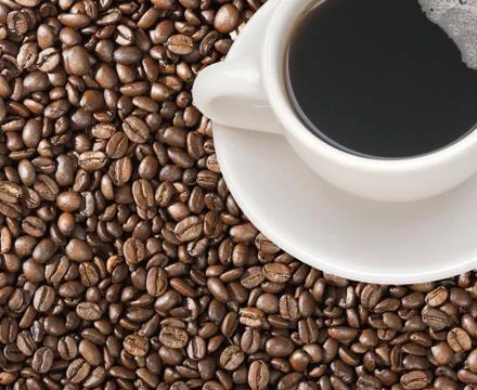 Coffee cup with coffee beans Stock Photos