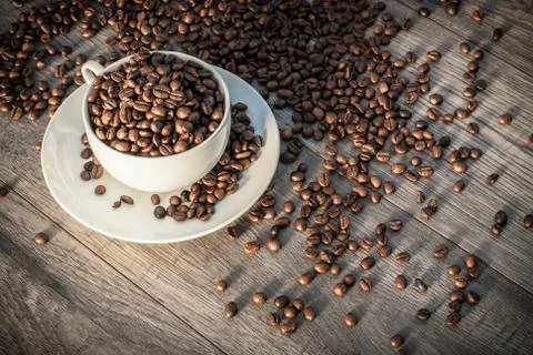 Coffee cup with coffee beans. Stock Photos