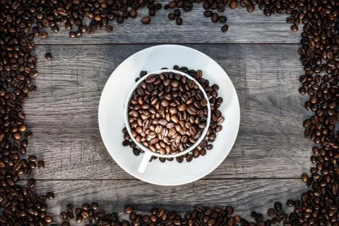 Coffee cup with coffee beans. Stock Photos