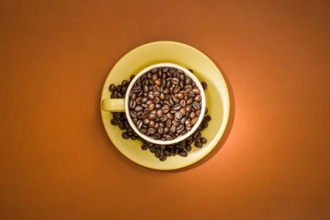 Coffee cup with coffee beans. Stock Photos