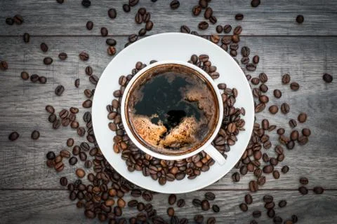 Coffee cup with coffee beans. Stock Photos