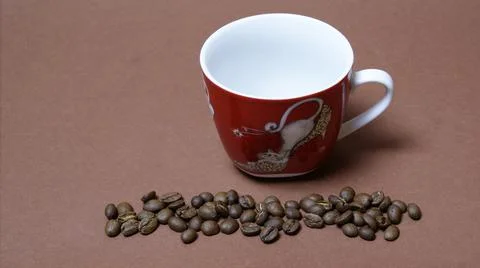 Coffee cup with coffee beans Stock Photos