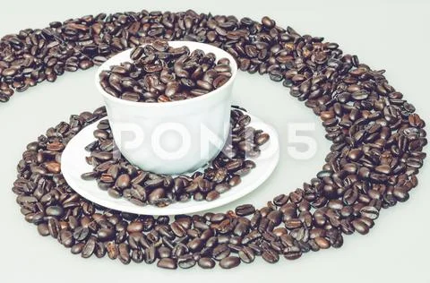 Coffee cup in a coffee whirl Stock Photos