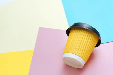 Coffee cup on colored paper Stock Photos