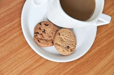 Coffee cup with cookie . Photos