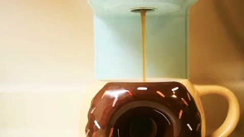 Coffee Cup Donut Mug Filled with Hot Coffee or Tea Stock Footage 106273746