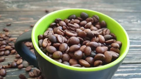 Coffee cup falling grain slow motion Stock Footage 151078102