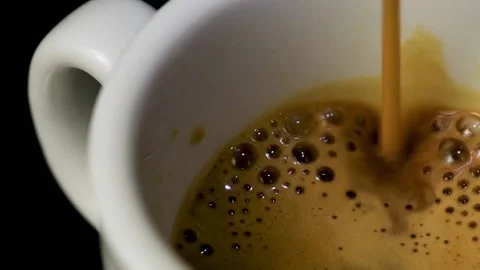 A coffee cup fill in slow motion Stock Footage 142546072