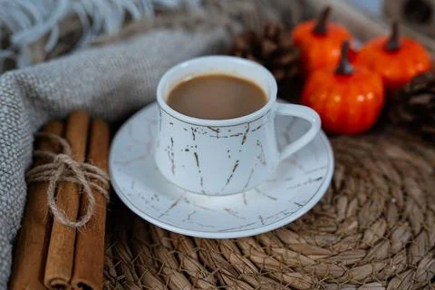 Coffee cup flat lay with autumn pumpkins and cinnamon Stock Photos