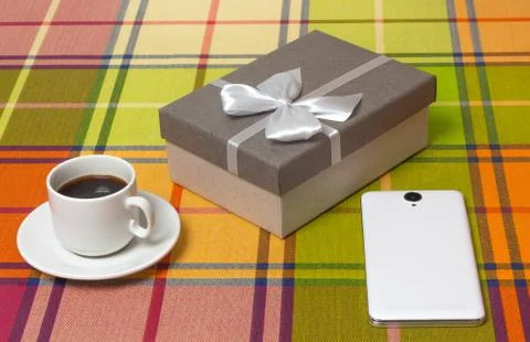 Coffee Cup gift in box smartphone on the table Stock Photos